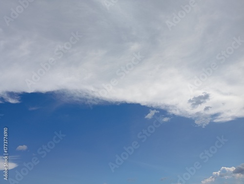 Vast blue sky meets soft white clouds creating a serene, airy backdrop for your next project