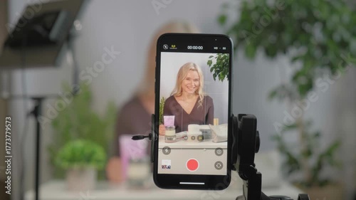 Face, makeup influencer or vlog with girl, spray or advice with content creator, promotion for cosmetics product or live streaming. Portrait, person or woman with item for skincare or record tutorial