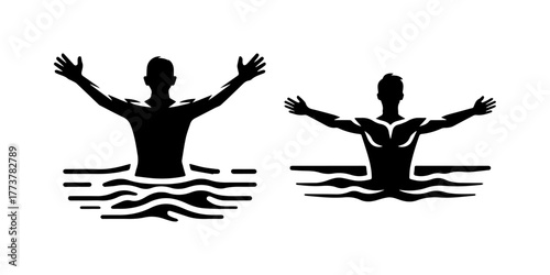 Silhouette of a person in water with arms outstretched.