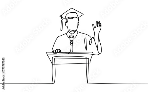 Graduation speaker addresses crowd from podium with microphone and waving hand