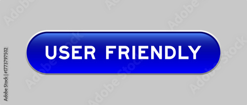 Blue color capsule shape button with word user friendly on gray background