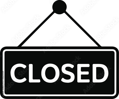Black and white closed sign hanging on white background