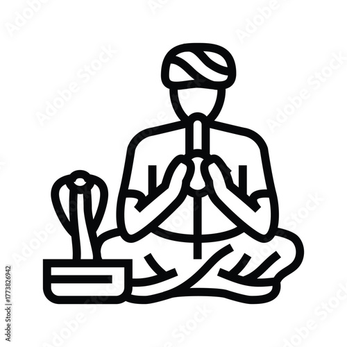 Person in turban playing flute for snake in basket