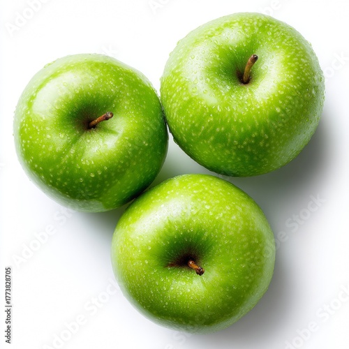 Three ripe green apples arranged attractively