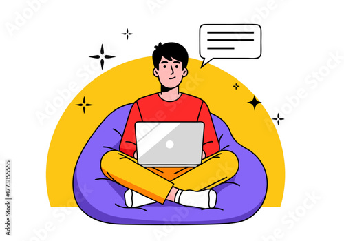 Young man sitting on beanbag chair with laptop, working remotely and communicating online