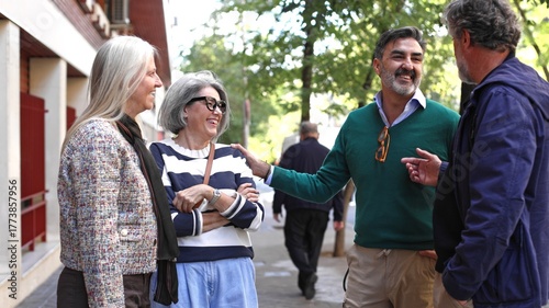 Group of mature adults socializing and laughing outdoor