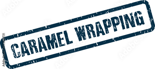A bold dark blue distressed Caramel Wrapping rubber stamp impression denotes packaging or confectionary