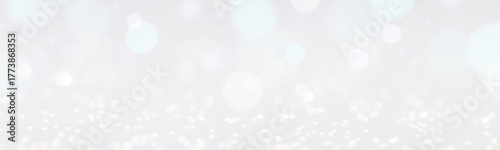 Christmas background with white glitters and bokeh lights. Banner design