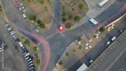 Smooth aerial pan uncovering Akron Stadium from one side, showing parking and surrounding land