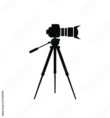 Silhouette of a professional camera mounted on a tripod