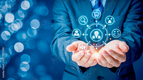 Businessman holding customer journey and engagement icons