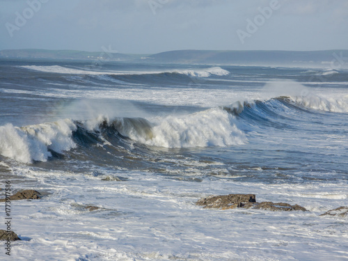 big waves breaking on rocks