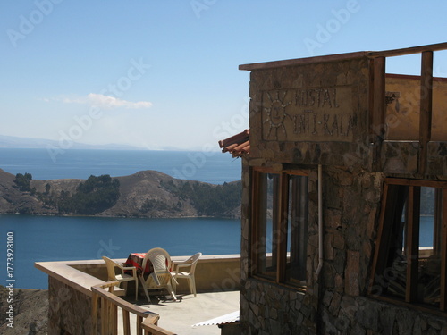 Konstfotografi A rustic stone guesthouse sits on Isla del Sol, Bolivia, with panoramic views of Lake Titicaca