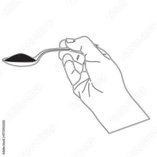 Hand holding spoon with powder