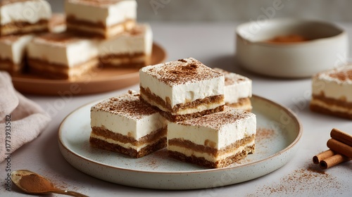 Wallpaper Mural Square layered dessert slices dusted with cocoa powder presented on contemporary ceramic dishware Torontodigital.ca