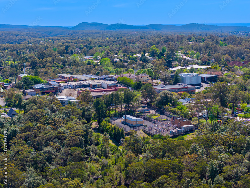 Fototapeta premium Drone aerial photograph of residential buildings and lush suburban foliage located in the town of Springwood in the Blue Mountains in New South Wales, Australia.