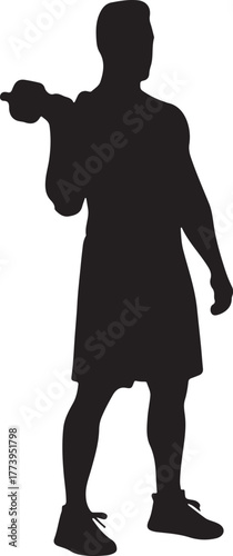 Silhouette of determined athlete lifting kettlebell in focused training session