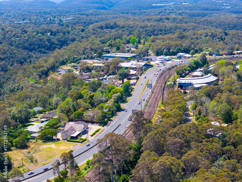 Drone aerial photograph of residential buildings and lush suburban foliage located in the town of Springwood in the Blue Mountains in New South Wales, Australia.