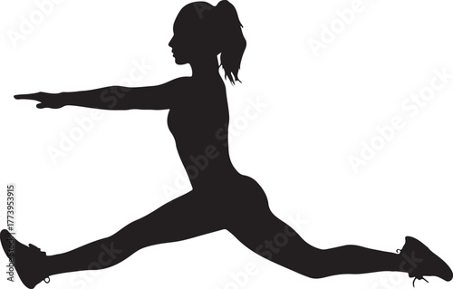 Silhouette of a female athlete doing a split exercise for flexibility