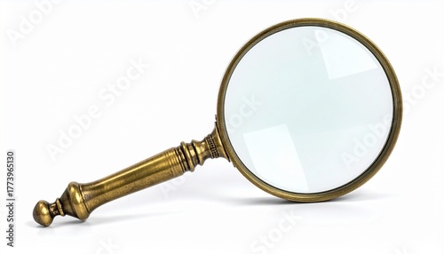Vintage magnifying glass with brass handle resting on white surface. Clear glass lens angled upward, symbolizing investigation, curiosity, and detailed observation.