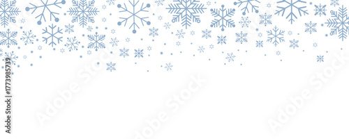 Winter snowflake border background with blue snowflakes and stars on white. Perfect for holiday, seasonal, Christmas, festive, greeting card, and decorative design projects on stock photo websites.