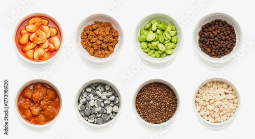 Assorted spice and ingredient bowls in minimalist white background