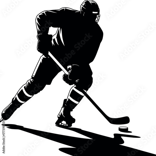 Black silhouette of hockey player with stick and puck