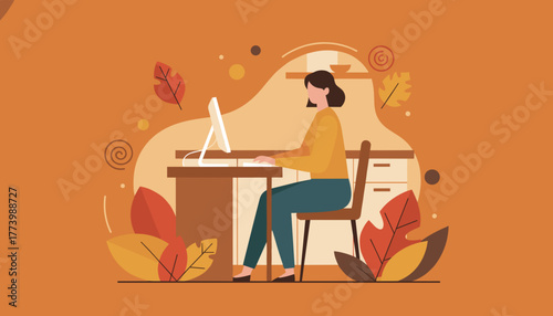 Woman working remotely on a computer at her desk in a cozy autumnal home office setting
