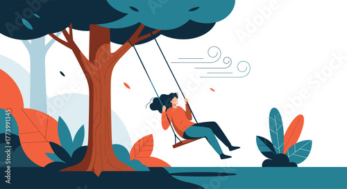 A happy young woman enjoys the freedom and joy of swinging on a tree swing in a serene park setting, surrounded by autumn foliage and a gentle breeze.