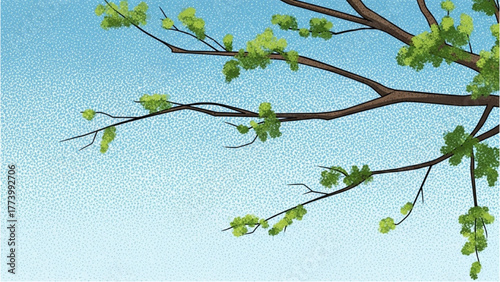 Branch with green leaves against a clear blue sky symbolizing spring growth and renewal