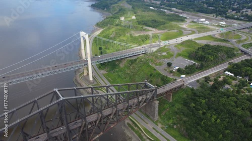 Aerial view of the world's largest cantilever bridge, the Quebec Bridge, alongside the Pierre-Laporte Suspension Bridge. An important road artery for Quebec City, Canada, 2025.