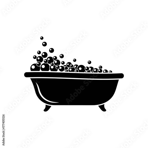 Bathtub overflows with bubbles in a minimalist bathroom, creating a relaxing and serene atmosphere for a calming spa day at home.