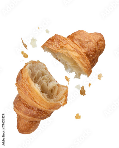 Torn falling croissant with crumbs on white isolated background