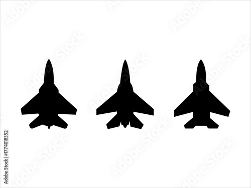 Silhouettes of three fighter jets flying in formation