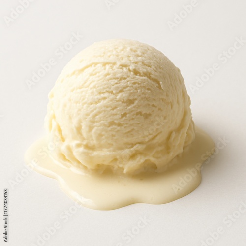 Melting vanilla ice cream scoop on white surface