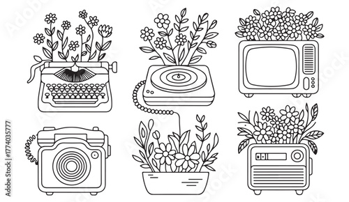 Elegant vintage device collection — typewriter, phone, TV, and record player with flower arrangements