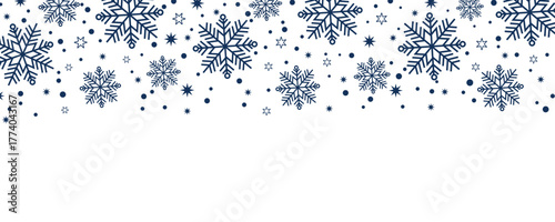 Winter snowflake border background with dark blue snowflakes and stars on white. Perfect for holiday, seasonal, Christmas, festive, greeting card, and decorative design projects