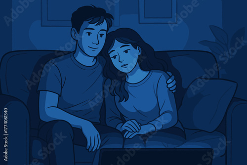 Young caucasian couple sitting on a sofa in a dimly lit room, with the man gently embracing the woman as they watch a screen together.