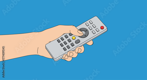 Hand holding a modern remote control against a vibrant blue backdrop, ready for entertainment and relaxation in a cozy home setting