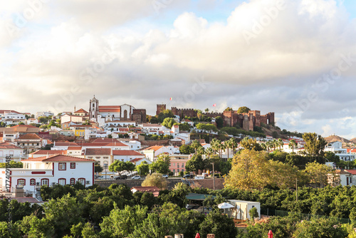 View of the old town of Silves with historic buildings, the old cathedral and the Castelo de Silves, Portimao region, Algarve Portugal