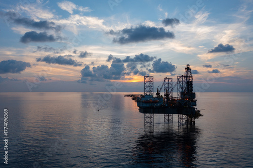 Foto Aerial view of offshore jack up rig and offshore platform during sunset for oil and gas exploration and production