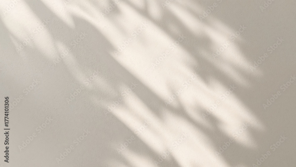 Naklejka premium Gentle Shadows Play on a Textured Wall, Creating an Abstract Visual Harmony.