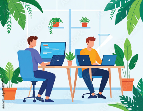 Two programmers working on laptops at a desk in a bright office