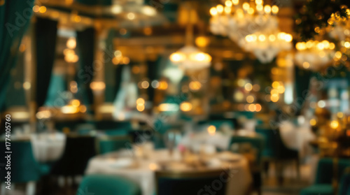 Blurred elegant restaurant interior with warm golden lights and green chairs, perfect for celebrations