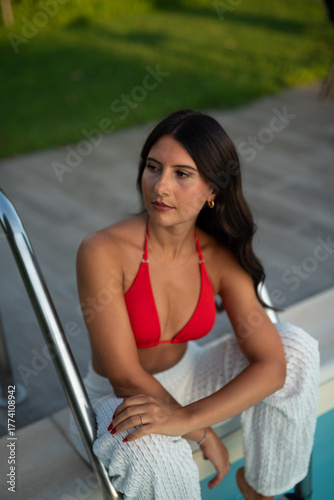 woman in red bikini at pool