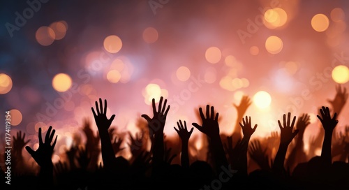 A joyful crowd silhouetted with hands raised high, celebrating against a vibrant rock and roll party backdrop filled with dazzling bokeh lights, capturing the spirit of live music and festivity.