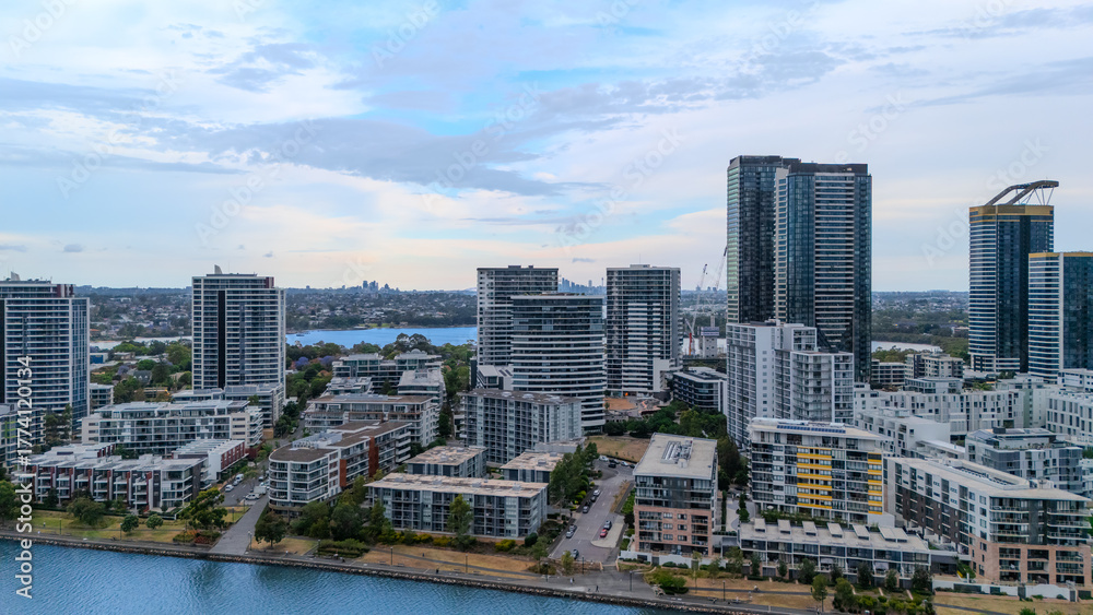 Naklejka premium Aerial Drone View of Wentworth Point and Rhodes a suburb in western Sydney newly built residential high rise apartments area on Parramatta River Sydney NSW Australia