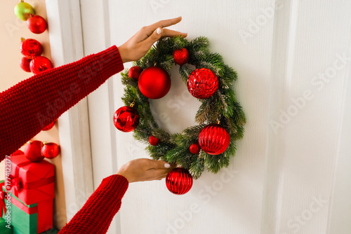 Female hands hanging Christ...