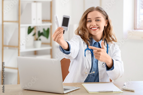 Female doctor with lancet p...