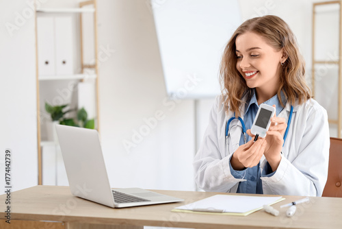 Female doctor with glucomet...